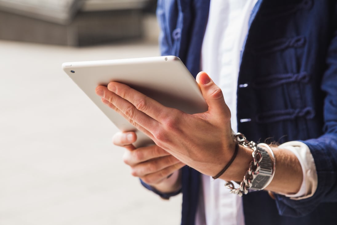 Man Holding Tablet